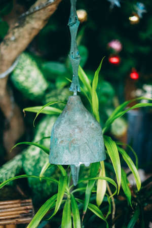 Rustic metal bell in tropical ambient