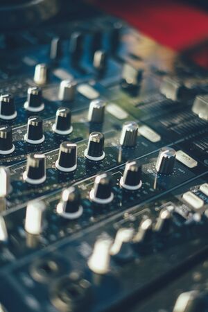 Professional mixing controller at the beach ** Note: Shallow depth of field