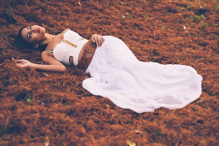 Portrait of beautiful wiccan girl in the forestの写真素材