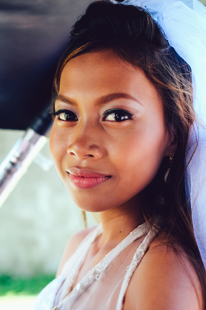 Portrait of a young beautiful Asian bride on her wedding dayの写真素材