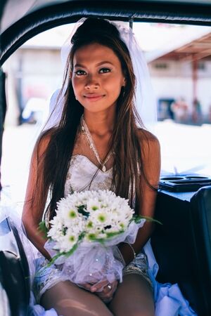 Portrait of a young beautiful Asian bride on her wedding dayの写真素材