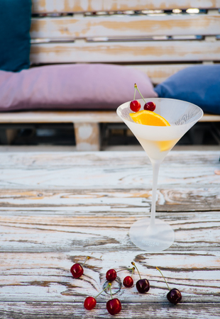 Vermouth cocktail with orange and cherry fruit in the glassの写真素材