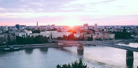 A late afternoon, sunset panorama of Novi Sad with rainbow bridge, Serbiaの写真素材