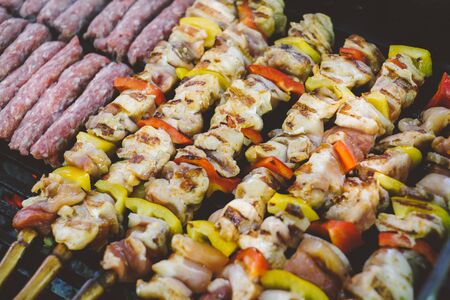 Grilling chicken meat skewers and skebab with vegetables on barbeque charcoal grillの写真素材