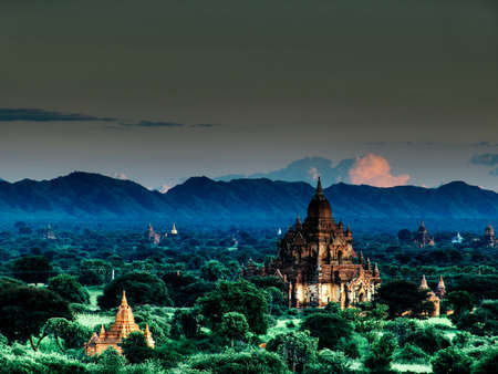 Landscape view during evening on temple area of Bagan with lush vegetation in Myanmarの写真素材