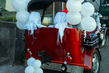 Beautiful wedding concept big trike, motorbike decorated with ballons and ribbonsの写真素材