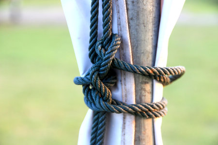 rope with knot.Useful to hold objects firmly, safely, and strong.The rope is a symbol of faith, determination, friendship and love given to the recipient.の写真素材