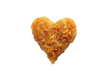 Heart created with pineapple paste isolated on white backgroundの写真素材