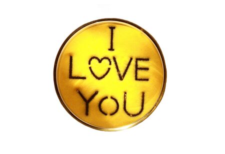 I love you created from yellow sand in cupの写真素材
