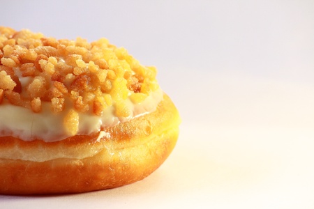 Delicious cream doughnut with toppingの写真素材