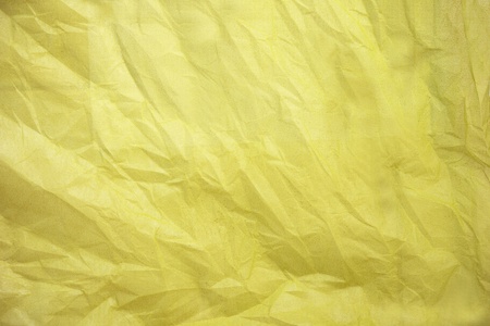 Creased green paper made from natural fabricの写真素材