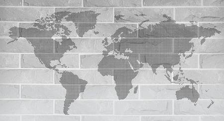 World map on grey brick wallの写真素材