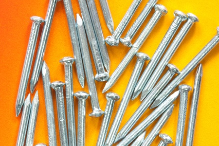 Nail on yellow backgroundの写真素材