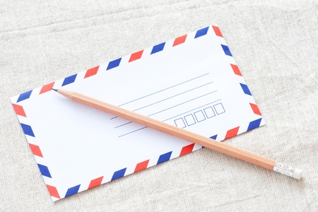 White envelope and pencilの写真素材