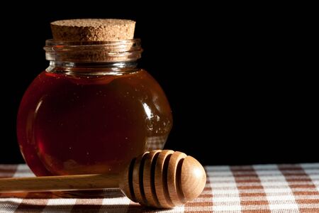 Honey and wood dipperの写真素材