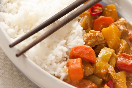 Delicious pork curry served with hot Thai jasmine riceの写真素材