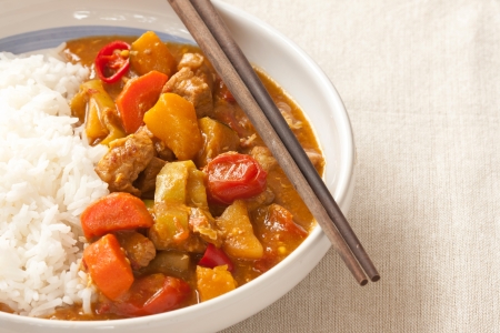 Delicious pork curry served with hot Thai jasmine riceの写真素材