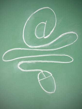 At sign connect with mouse on Blackboardの写真素材