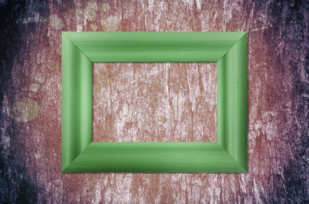 Blank wood frame on grunge background