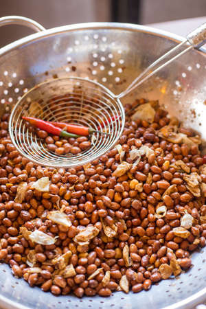 "Adobong Mani" is a popular filipino street food.  It is peanut seasoned with garlic and salt then roasted. Some prefer it with chiliの写真素材