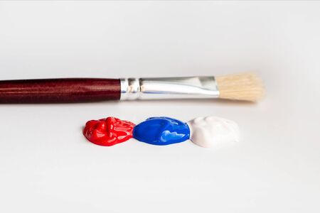 Russia. russian flag. paint and brush. children draw the Russian flag.の写真素材