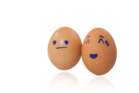 Emotional faces drawn on two eggs.の写真素材