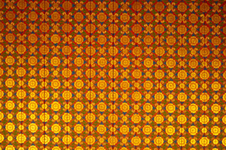 Thai pattern on the wall of a Thai templeの写真素材