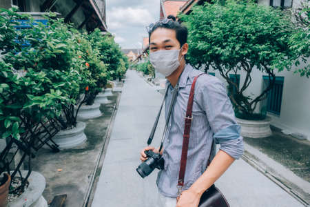 Bangkok / Thailand - 16 January 2019: A man with a camera to travel in Bangkok in Thailandのeditorial素材