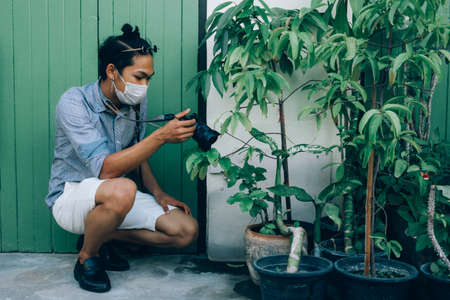 Bangkok / Thailand - 16 January 2019: A man with a camera to travel in Bangkok in Thailand
