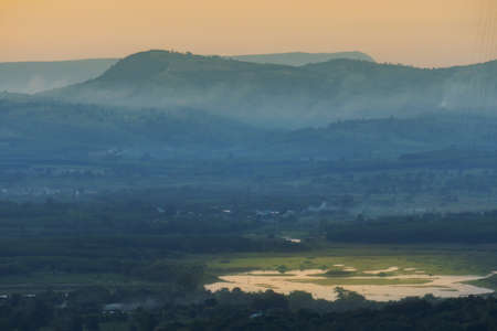 Morning mist in the middle of the valleyの写真素材