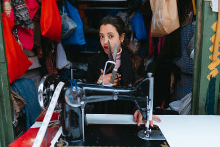 Young women working in a tailor shopの写真素材