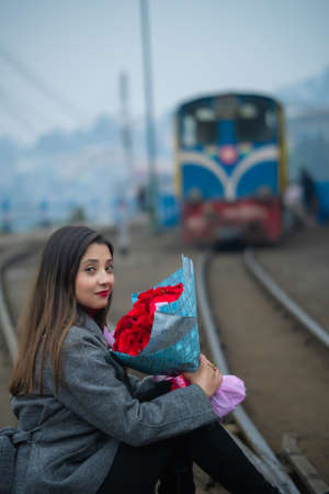 Girl with a bouquet of roses on Valentine's Dayの写真素材