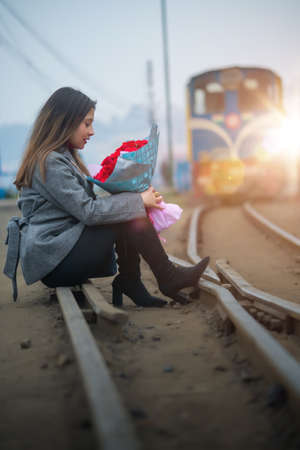 Girl with a bouquet of roses on Valentine's Dayの写真素材