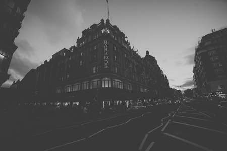 LONDON, ENGLAND - July 7, 2017. Exterior of Harrods department store in the Brompton Road, Knightsbridge showing shoppers passing by.のeditorial素材