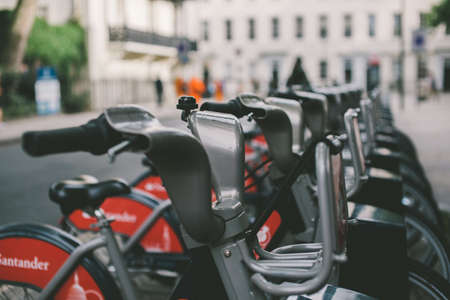 London, England - February 2018: Close up view of bicycles for hire in docking station on a city streetのeditorial素材