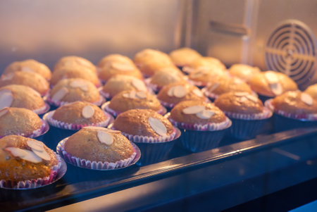banana cake topping with almond on tray in hot ovenの写真素材