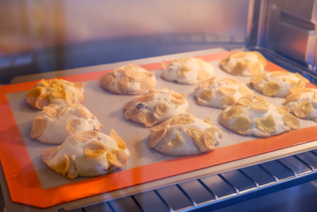 Raisin and cornflake cookies in hot oven