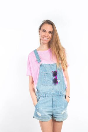 Beautiful smiling woman in overallsの写真素材
