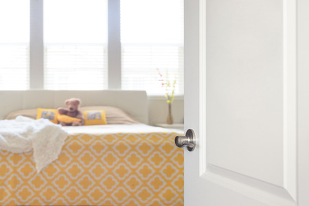 White door opened to bedroom