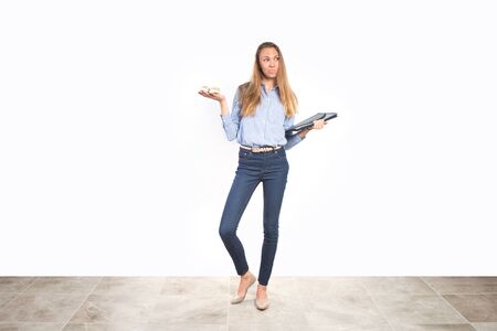 Young mom balancing work and family lifeの写真素材