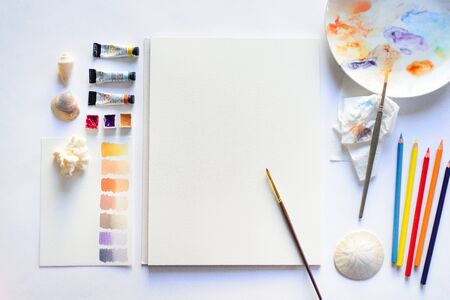 Drawing mockup with blank textured paper and watercolorsの写真素材