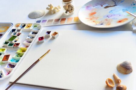 Drawing mockup with blank textured paper and watercolorsの写真素材