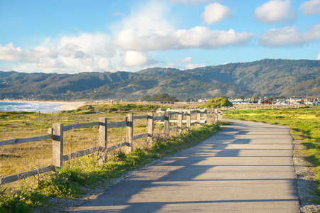 Beautiful scenic road on the green bluff above the ocean beachの写真素材