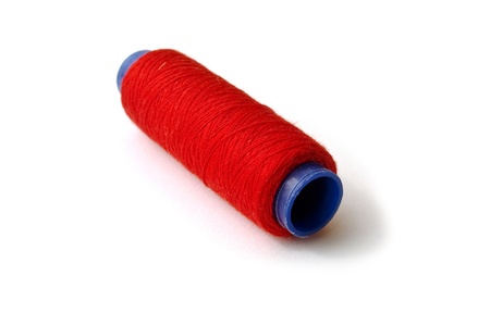 Red spool on a white backgroundの写真素材