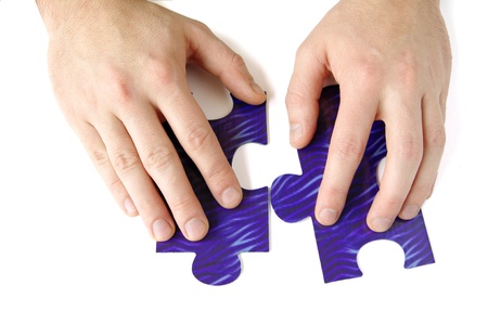 Hands and puzzle, isolated on white background 