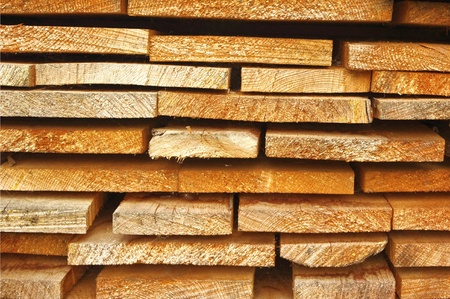 Close up view of old stacked wooden boards の写真素材