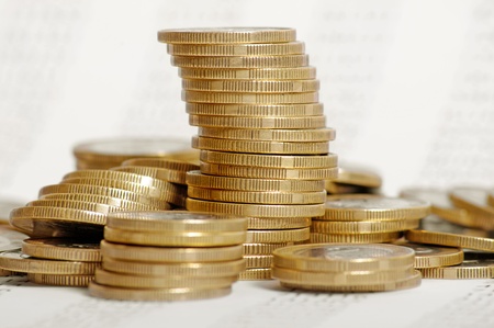 Close up of the golden coin stacks on background with numbers 