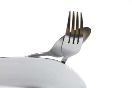 A stack of plate, knife and fork