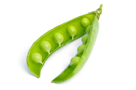 Fresh green peas isolated on white の写真素材