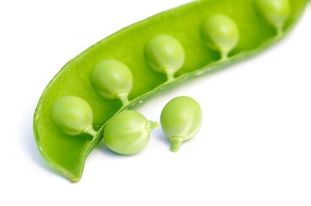 Fresh green peas isolated on white の写真素材